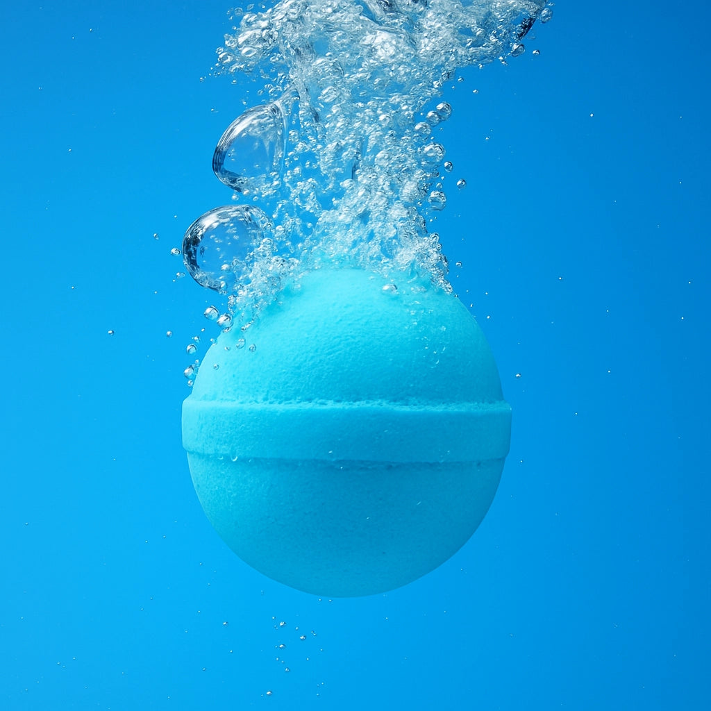 Blue bath bomb with water splashes against a blue background