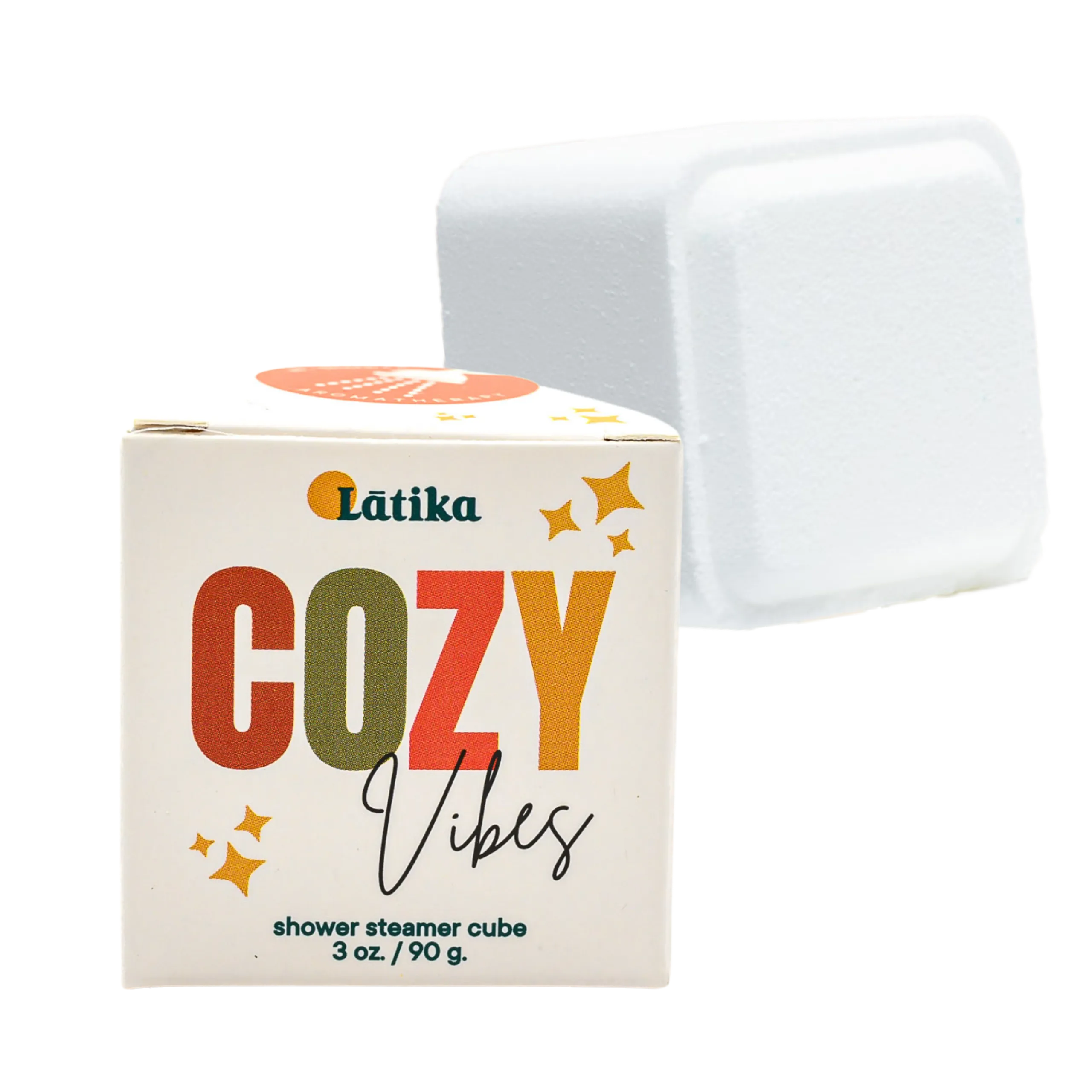 Látika Cozy Vibes shower steamer cube with packaging on a white background