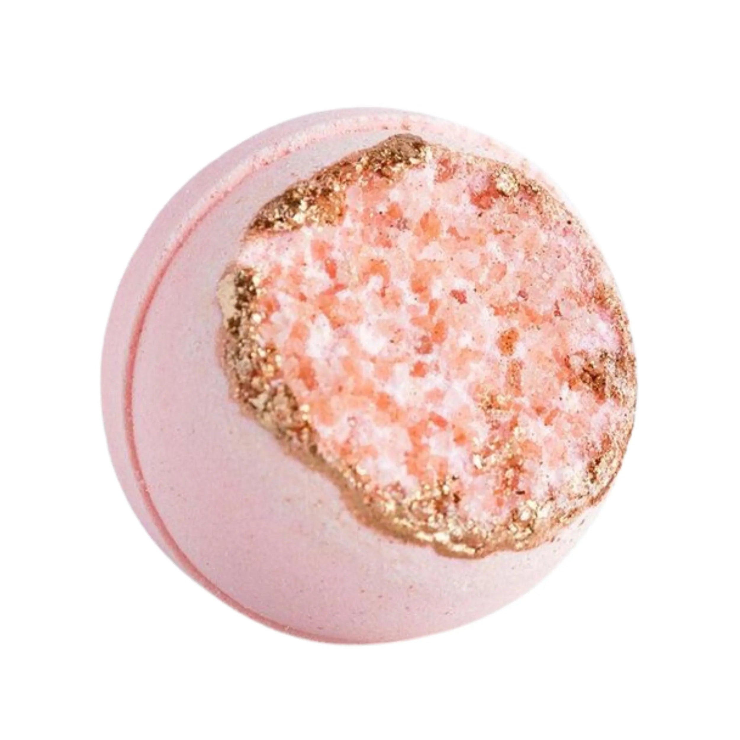 Pink bath bomb with gold glitter on a white background