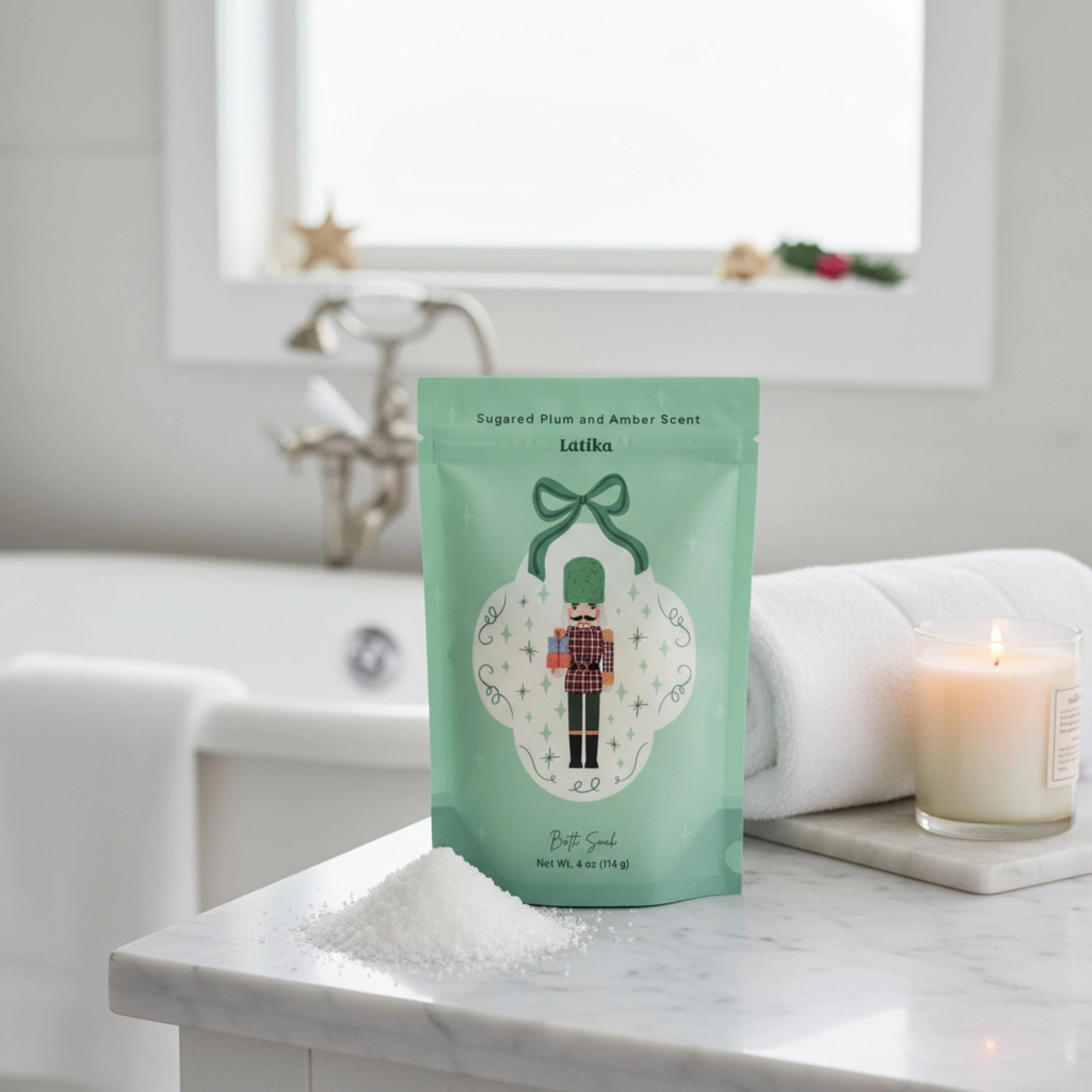 Bag of bath salts with a decorative label on a marble surface next to a candle.