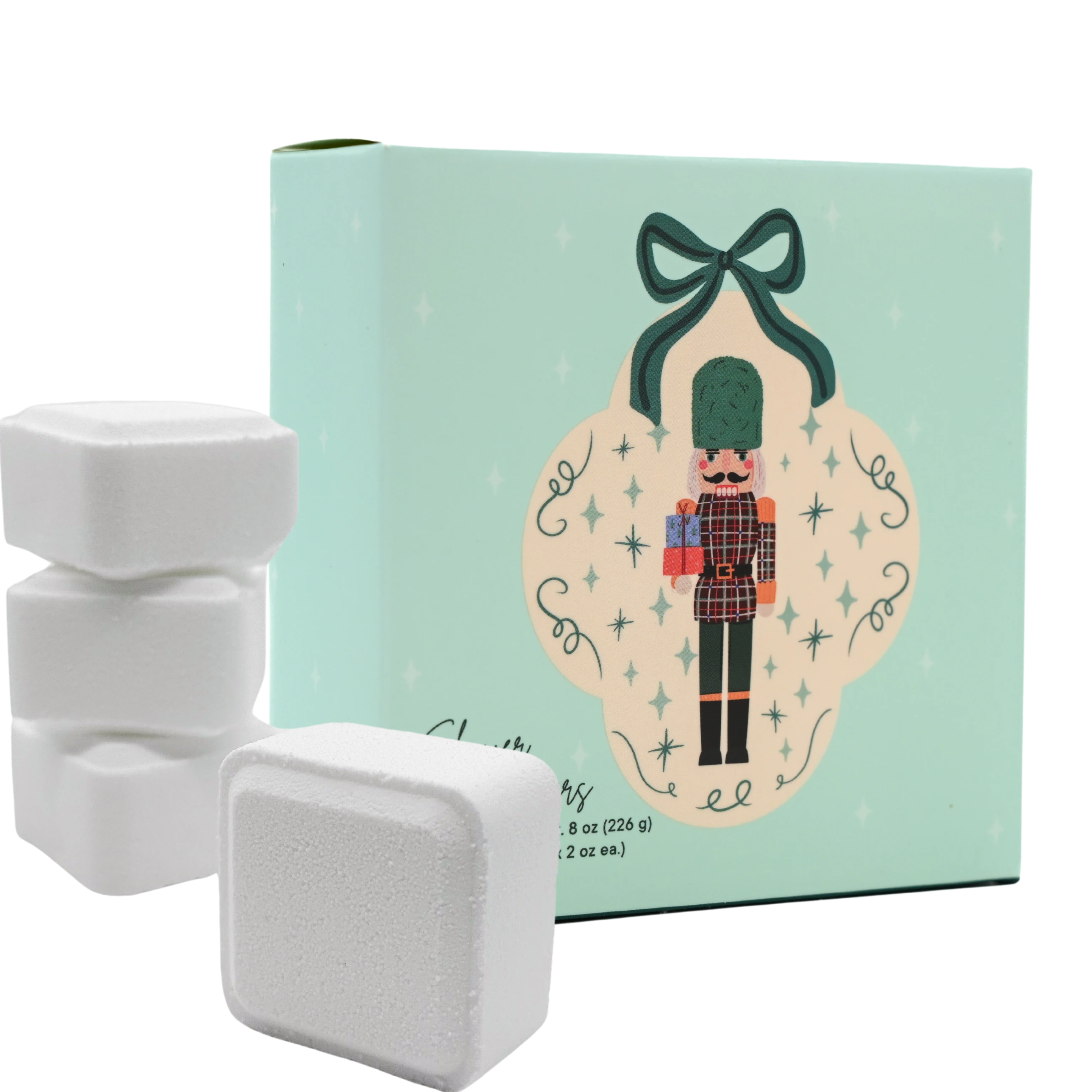 White shower steamers with a decorative box featuring a nutcracker design on a white background