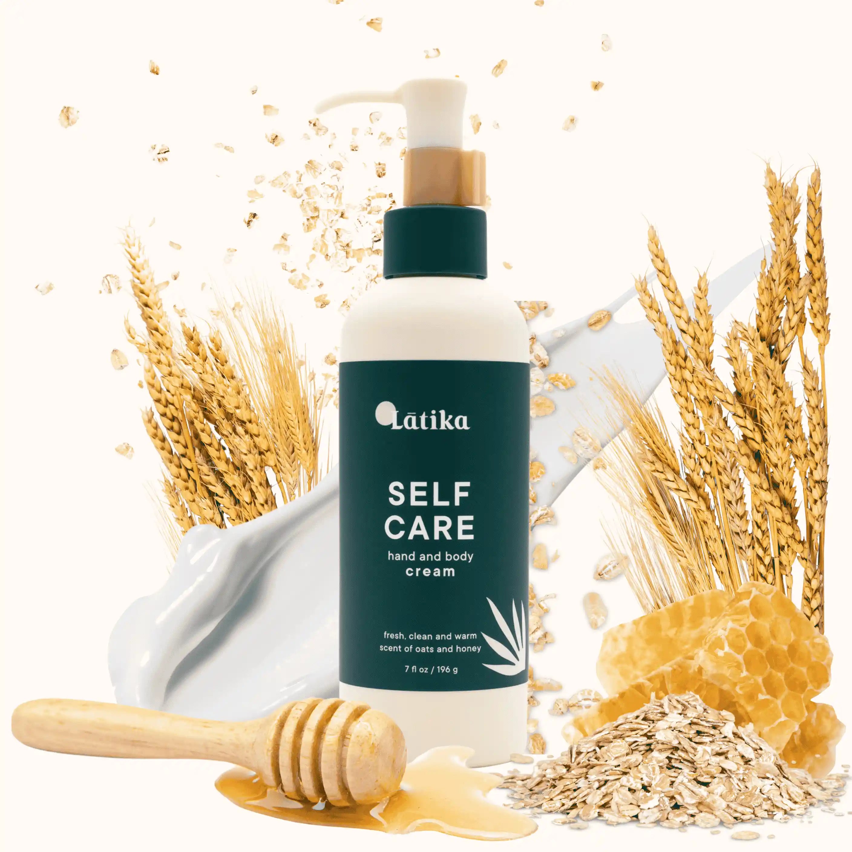 Látika self care hand and body cream bottle with wheat, honey, and oats on a white background