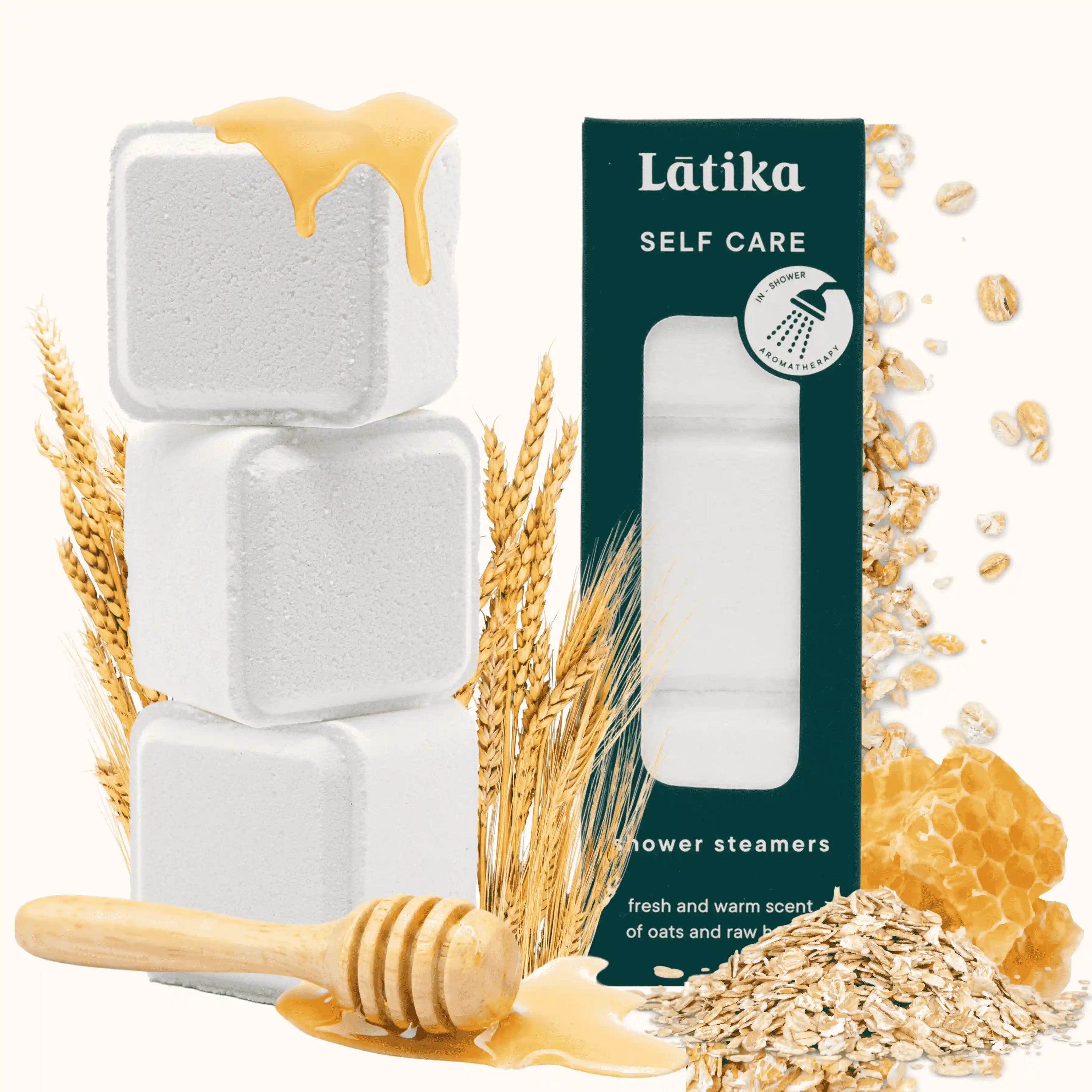 Latika self-care shower steamers with oats, honey, and a wooden dipper on a white background