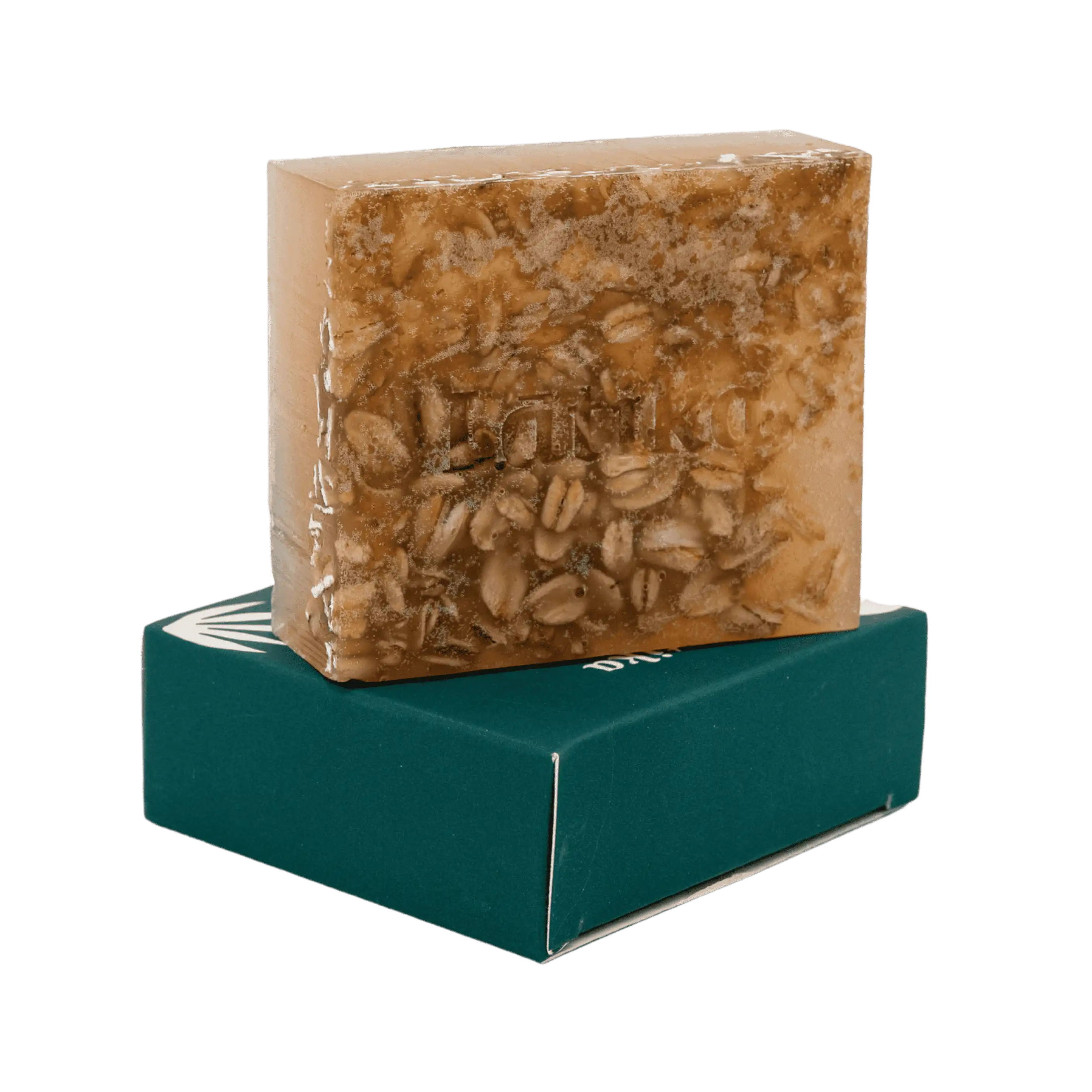 Bar of soap with visible oat pieces on a green stand against a white background