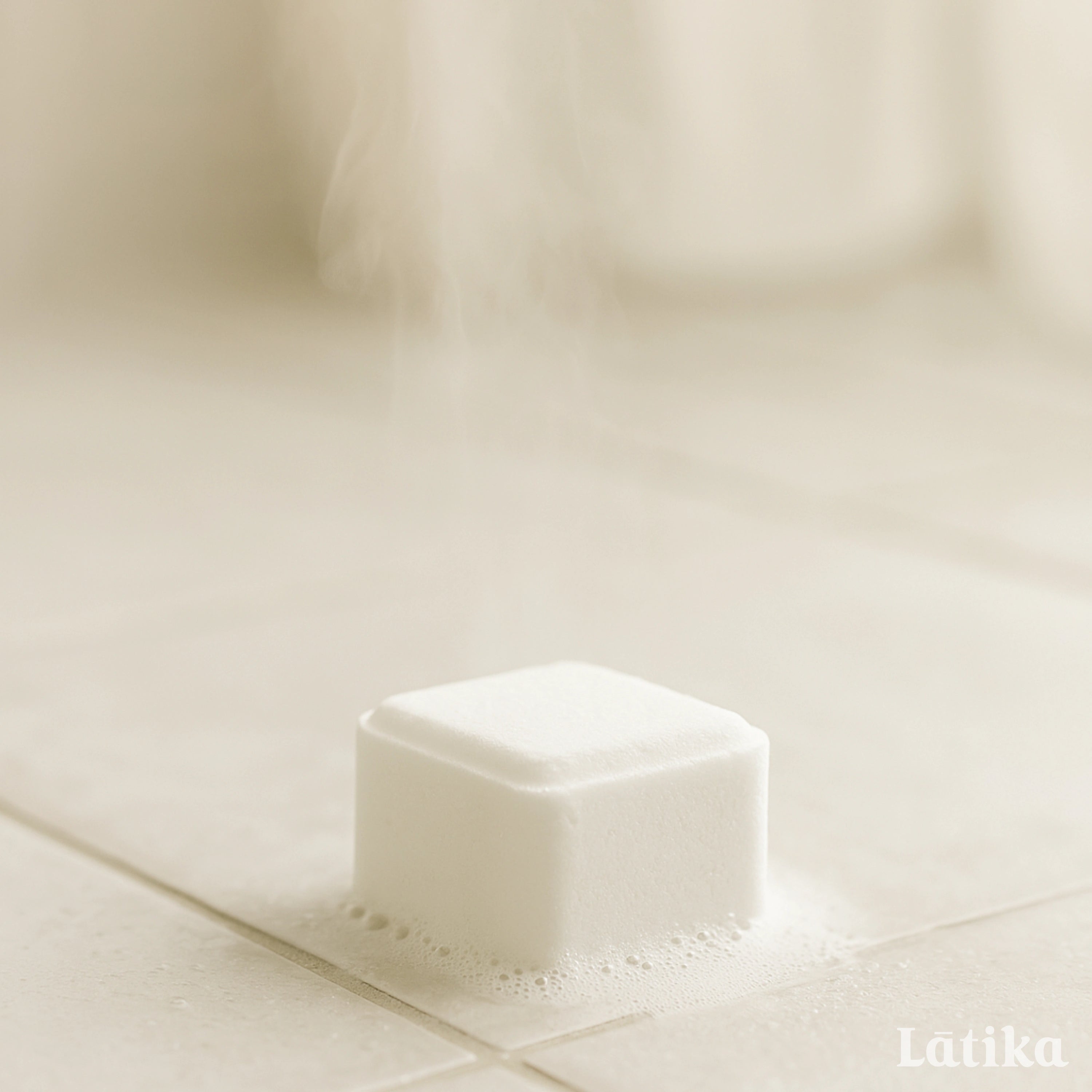 white shower steamer on a shower floor with bubble and steam