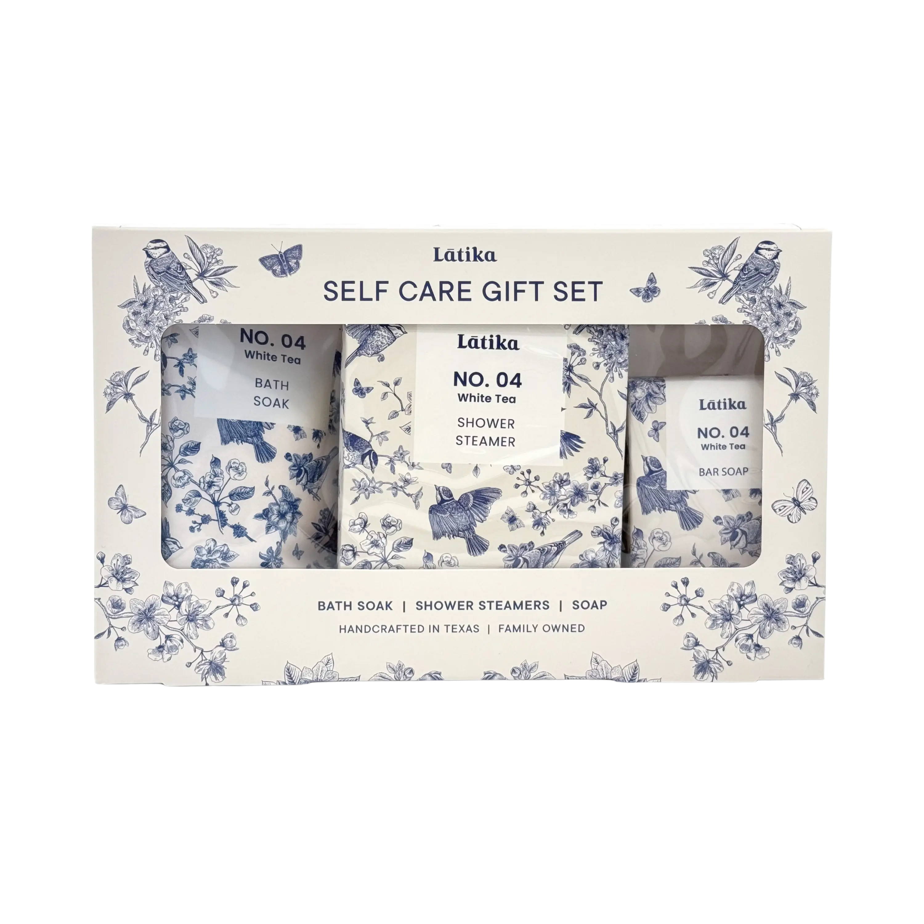 Latika self-care gift set with bath soap, shower steamer, and bar soap in decorative packaging.