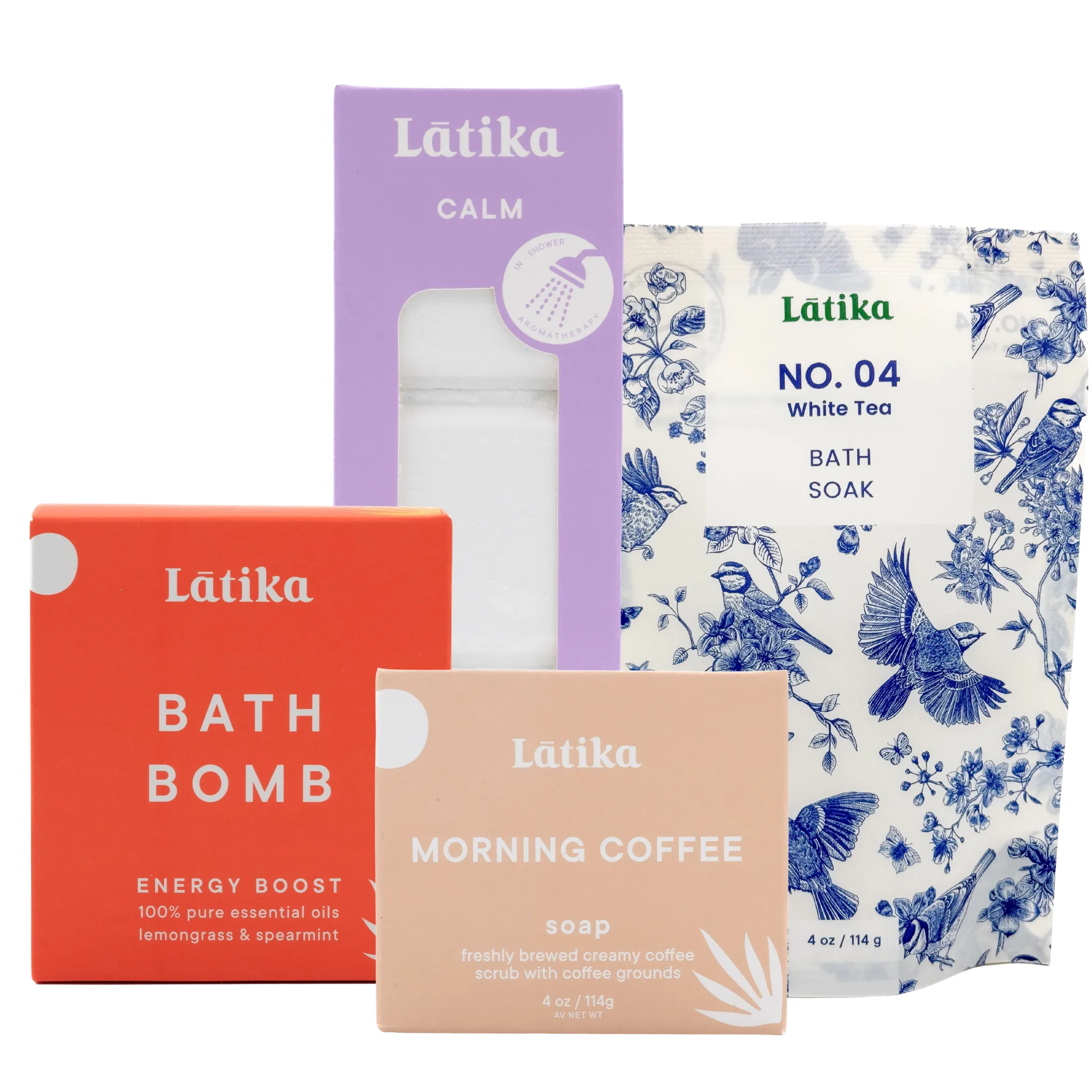 Collection of Látika bath products including a bath bomb, soap, and bath soak on a white background.