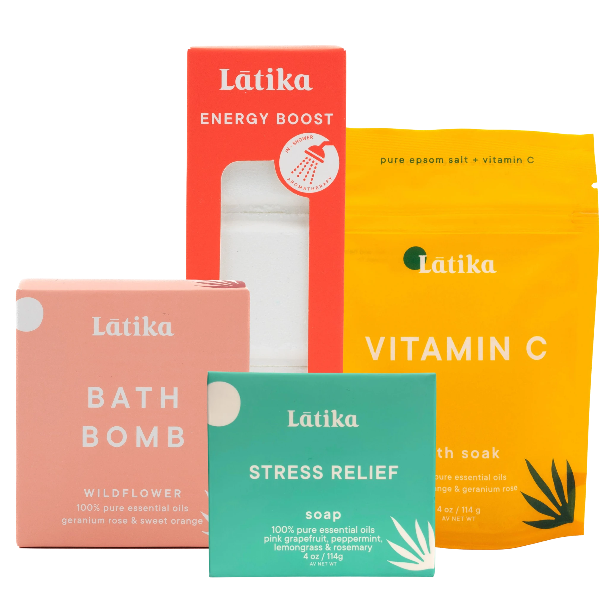 Collection of Látika skincare and wellness products including a bath bomb, soap, and bath salt on a white background.