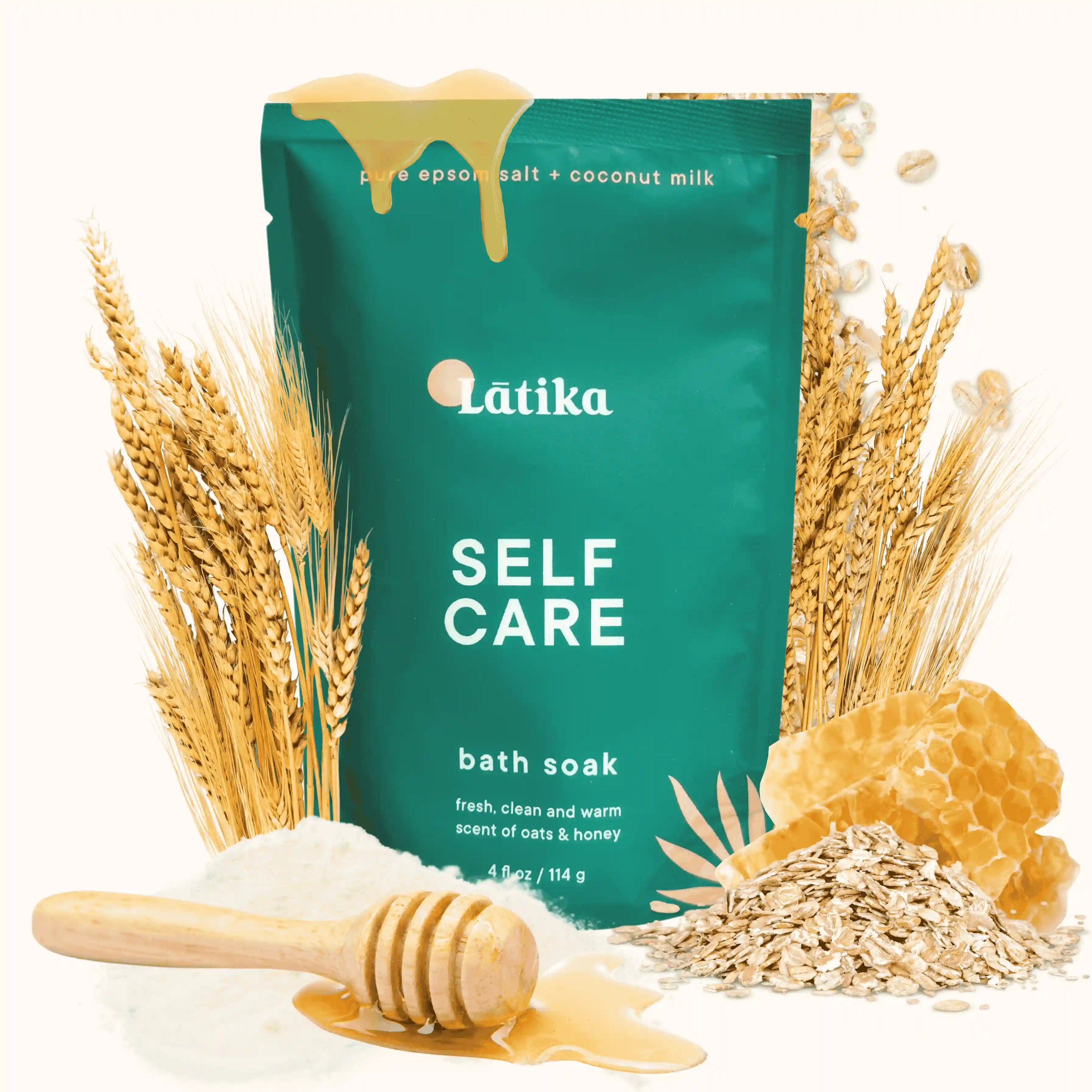 Latika Self Care bath soak packaging with oats, honey, and a wooden spoon on a white background