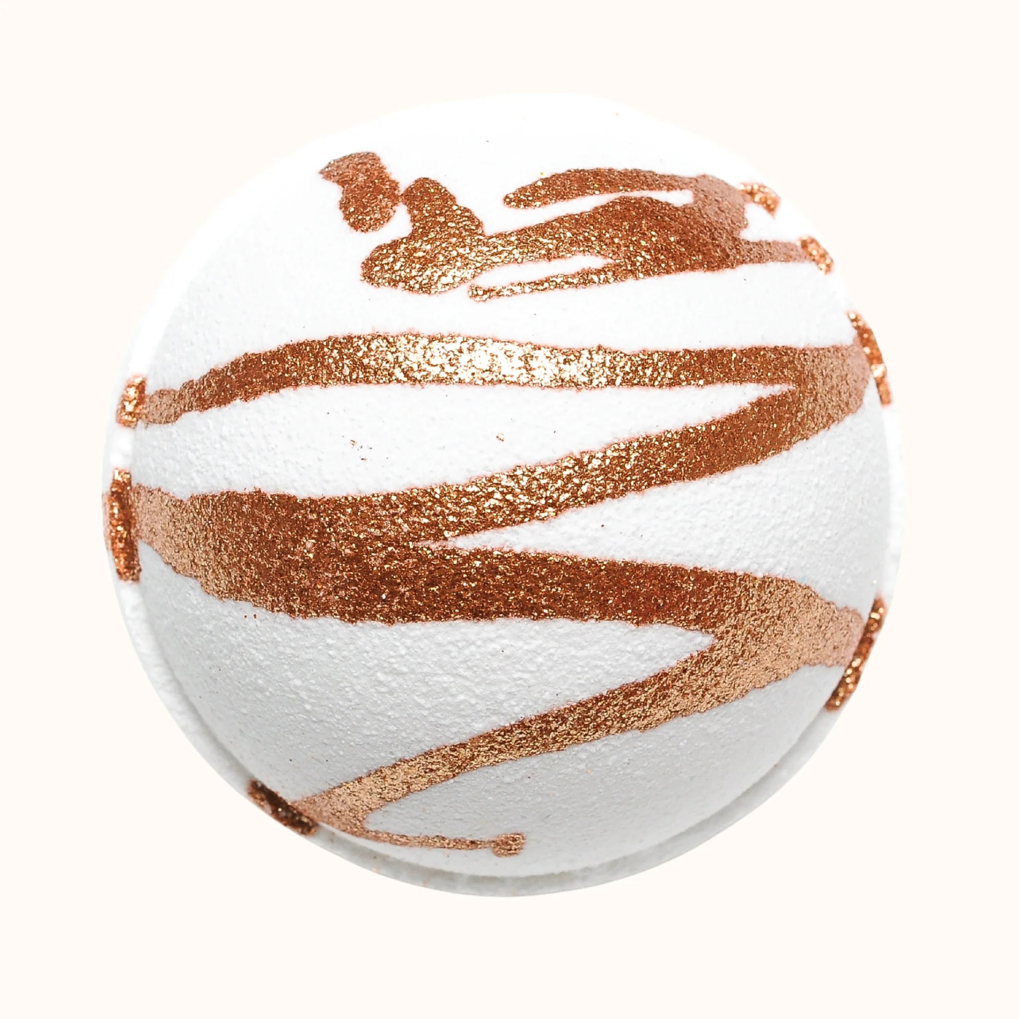 White bath bomb with rose gold glitter stripes made with coconut milk for a oothing soak