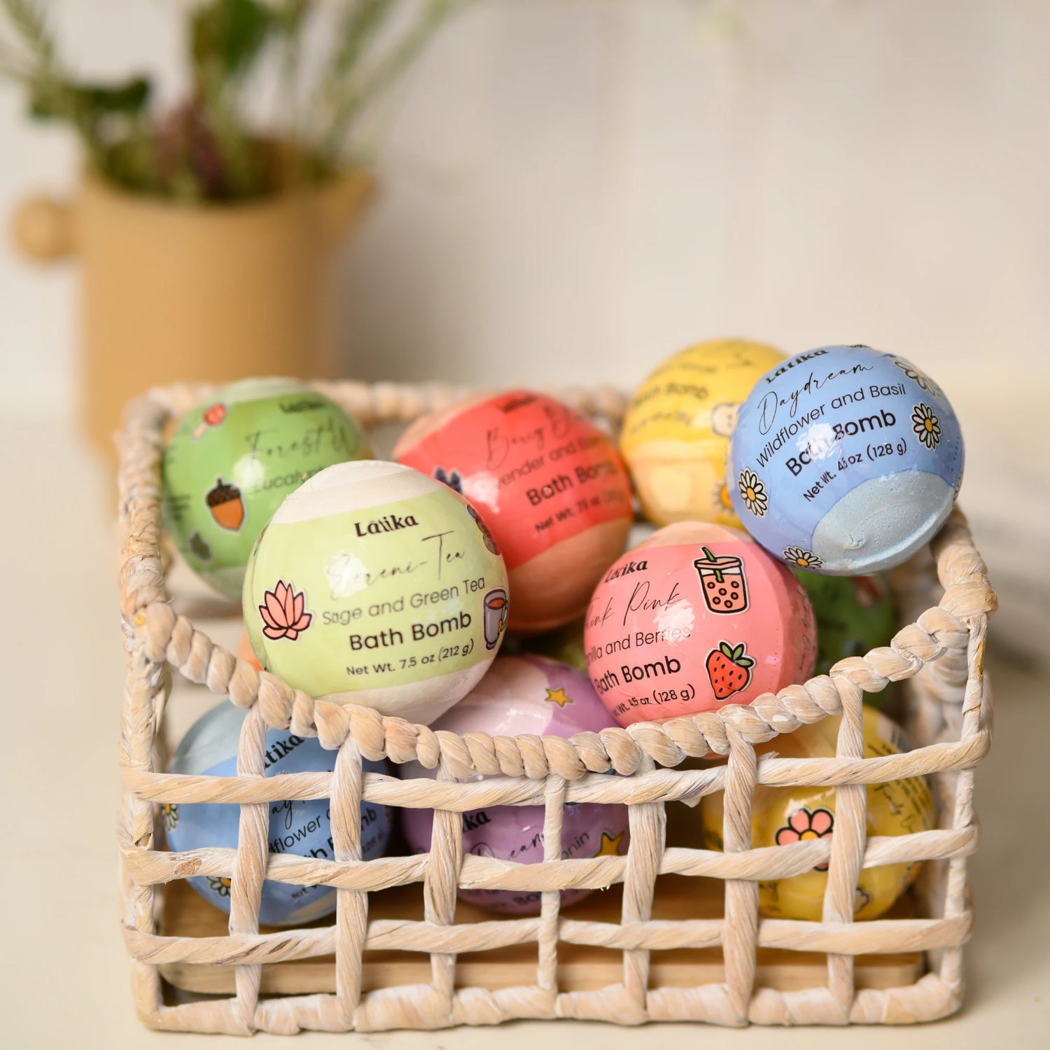 Colorful bath bombs in a woven basket with a plant in the background
