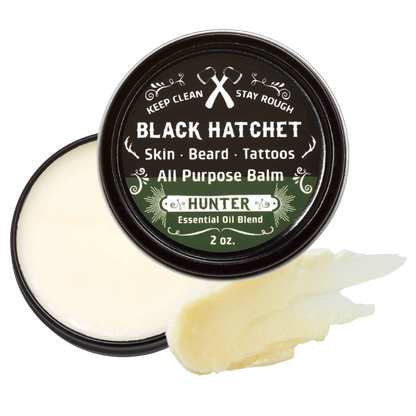 Black Hatchet all-purpose balm with a sample on a white background