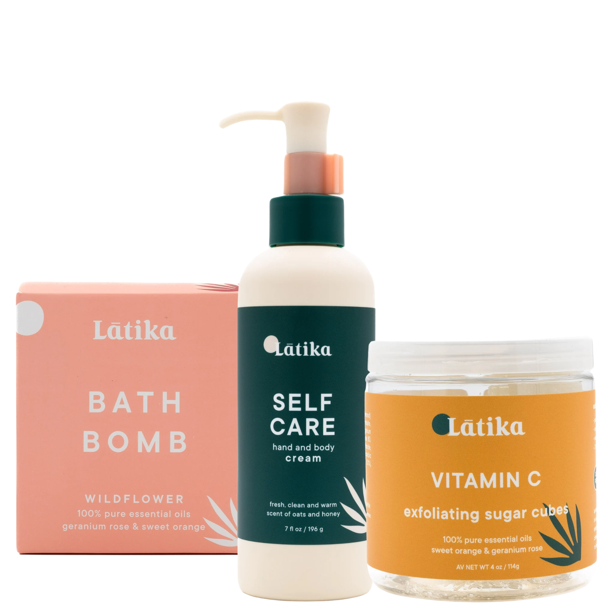 Collection of Latika self-care products including a bath bomb, hand and body cream, and vitamin C exfoliating sugar cubes on a white background.