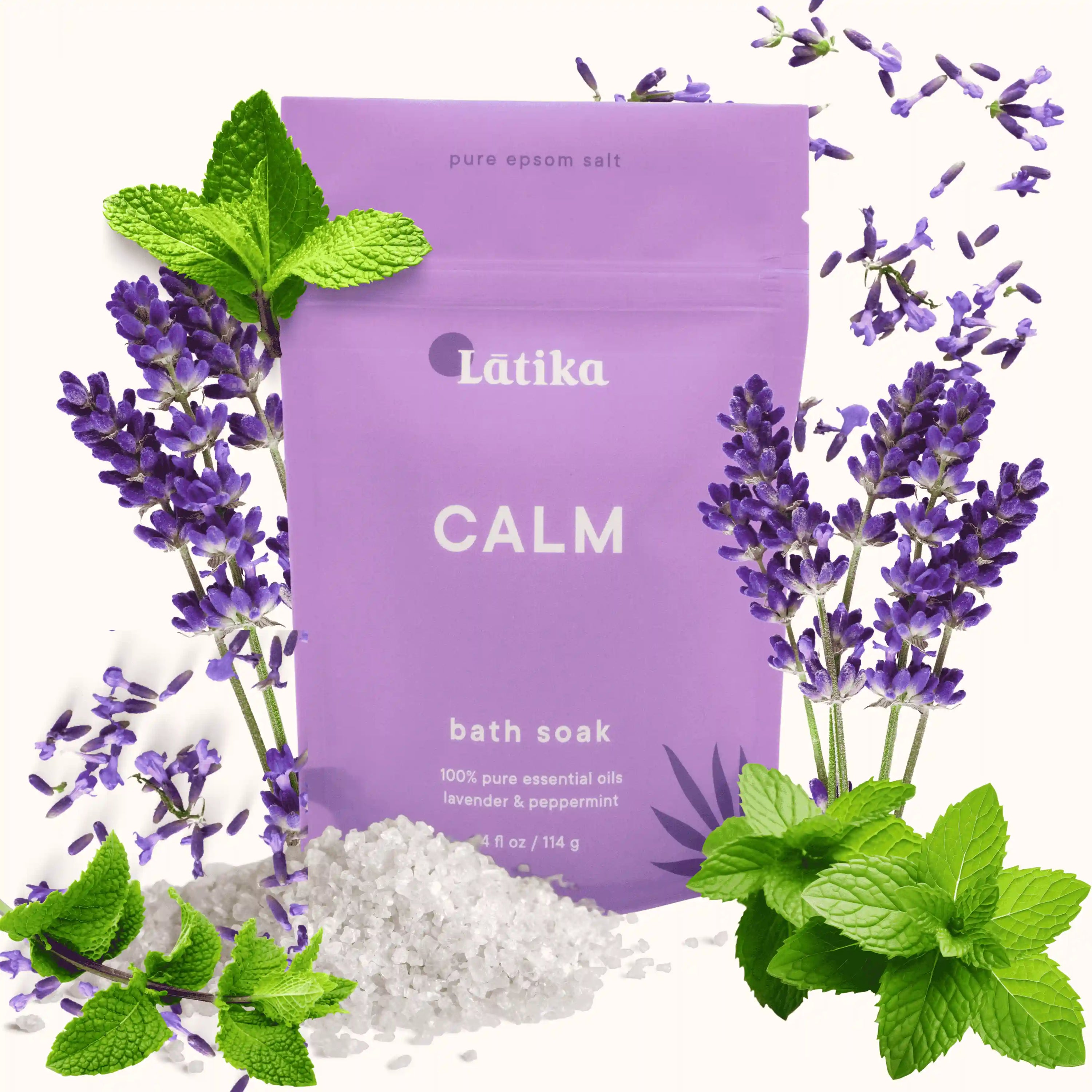 Purple packaging of Latika Calm bath soak with lavender and mint leaves on a white background
