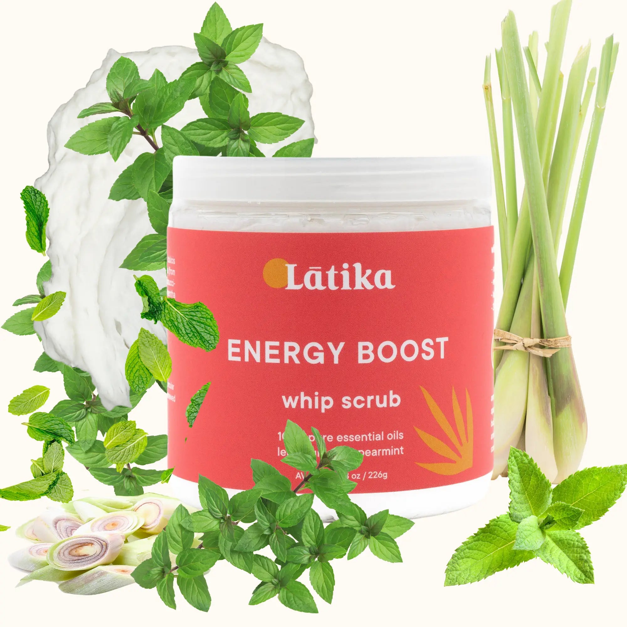 Latika Energy Boost whip scrub packaging with green leaves and lemongrass. in a red jar. for energizing natural scrub.