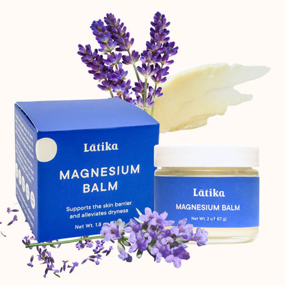 Latika magnesium balm with blue packaging and lavender flowers on a white background