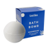 magnesium infused bath bomb next to its blue packaging with &
