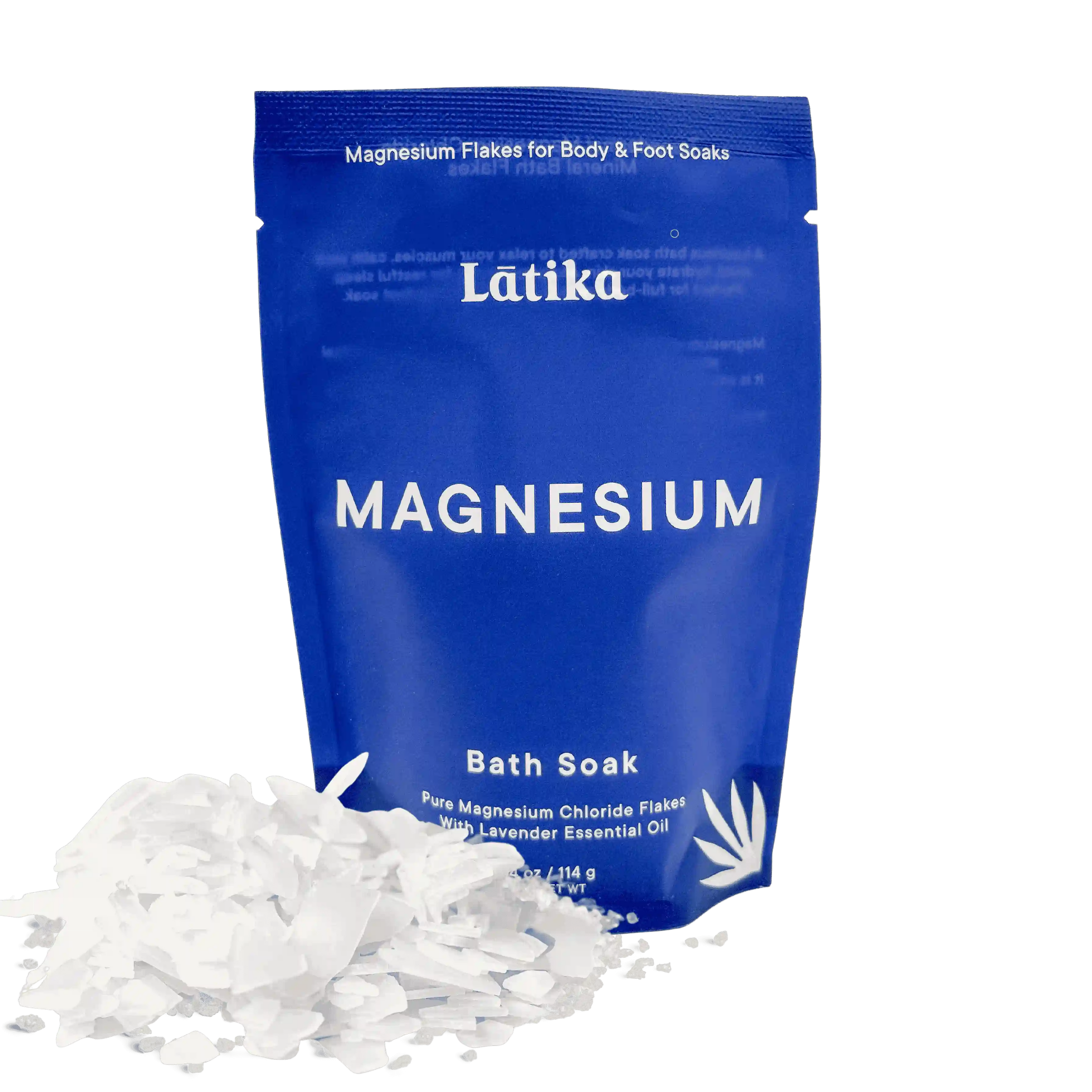 Blue package of Latika magnesium bath soak with white magnesium flakes on a white background