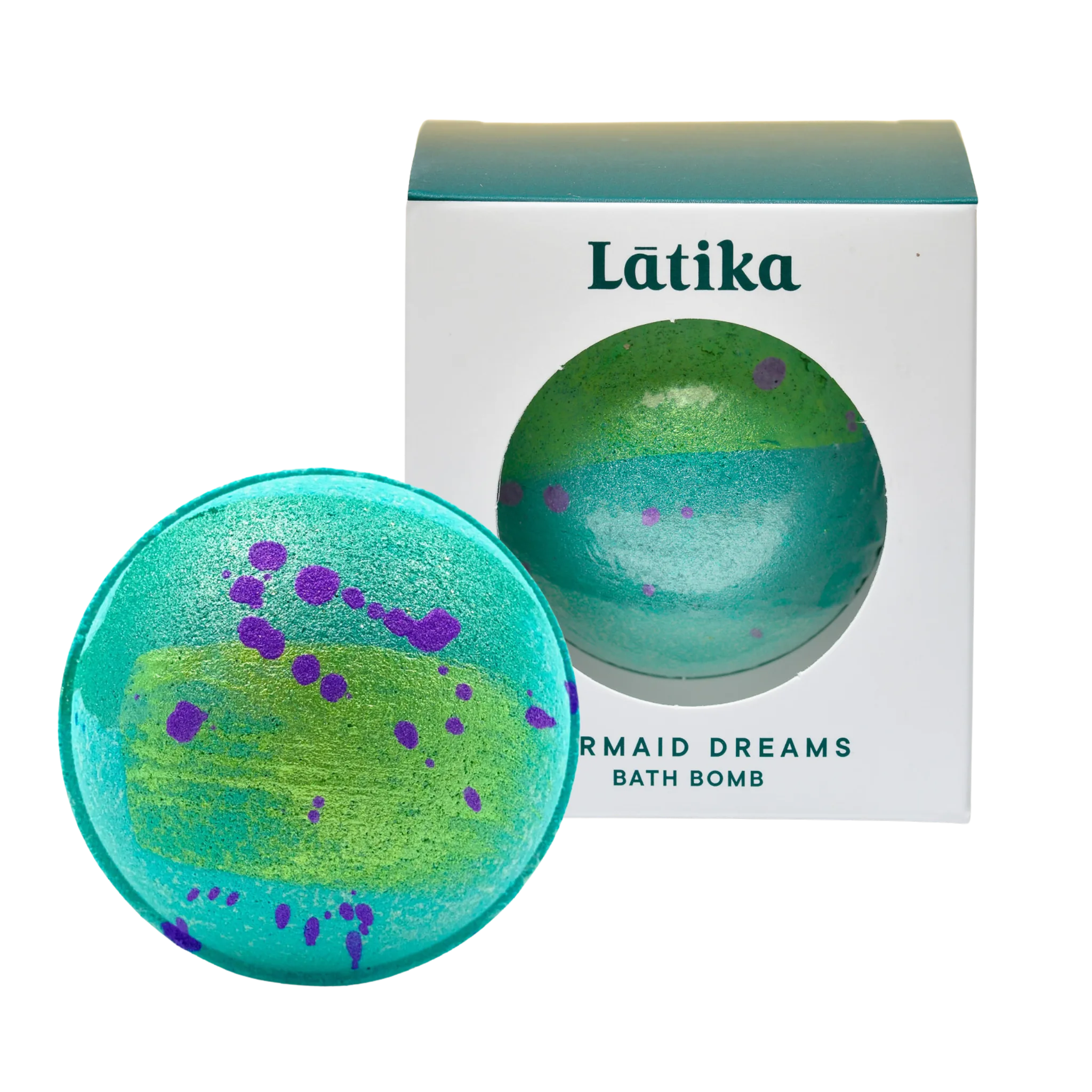 Green and purple bath bomb with packaging labeled &