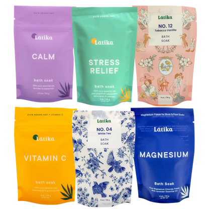 Collection of Latika bath salt packages in various flavors on a white background