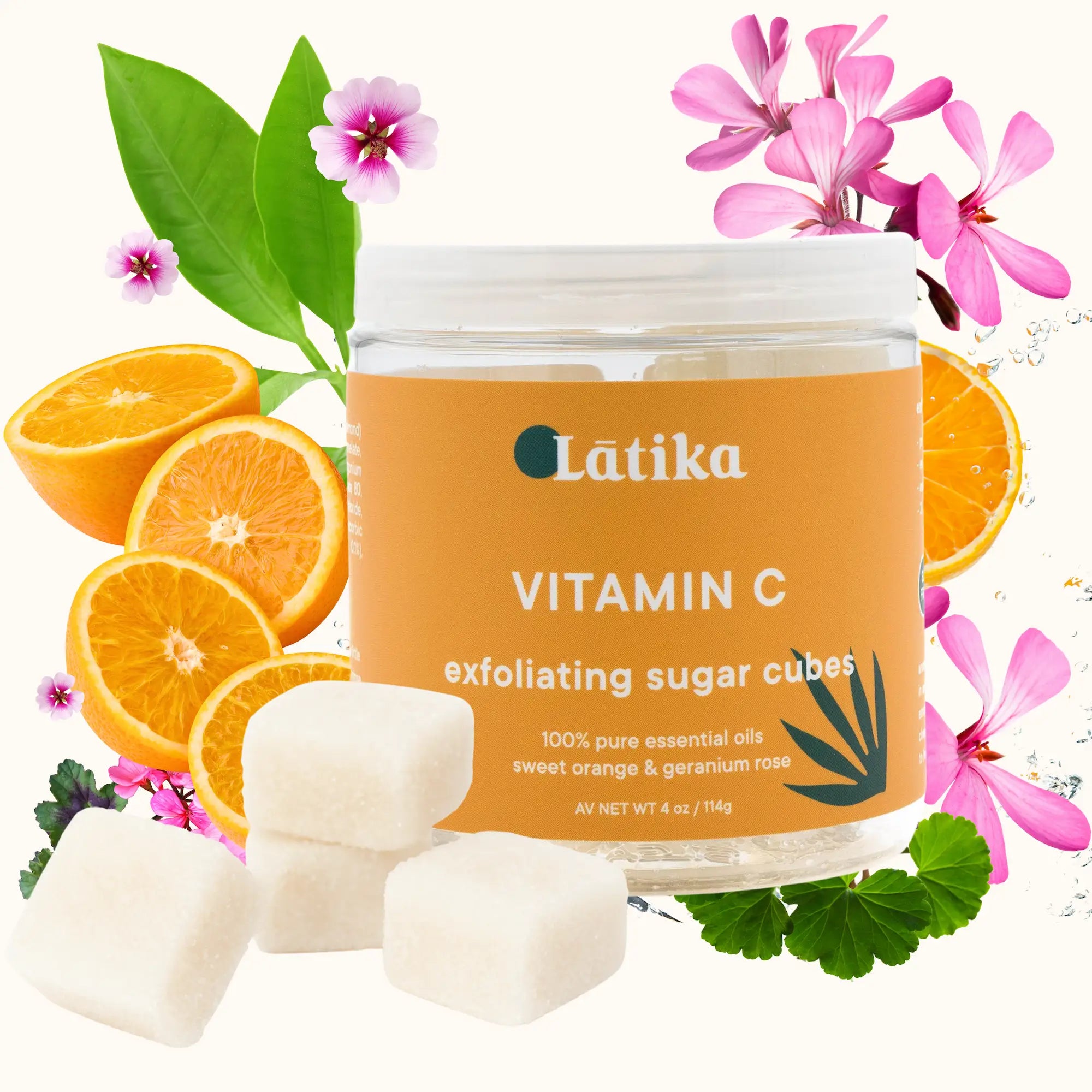 Jar of Latika Vitamin C exfoliating sugar cubes with oranges and flowers on a white background