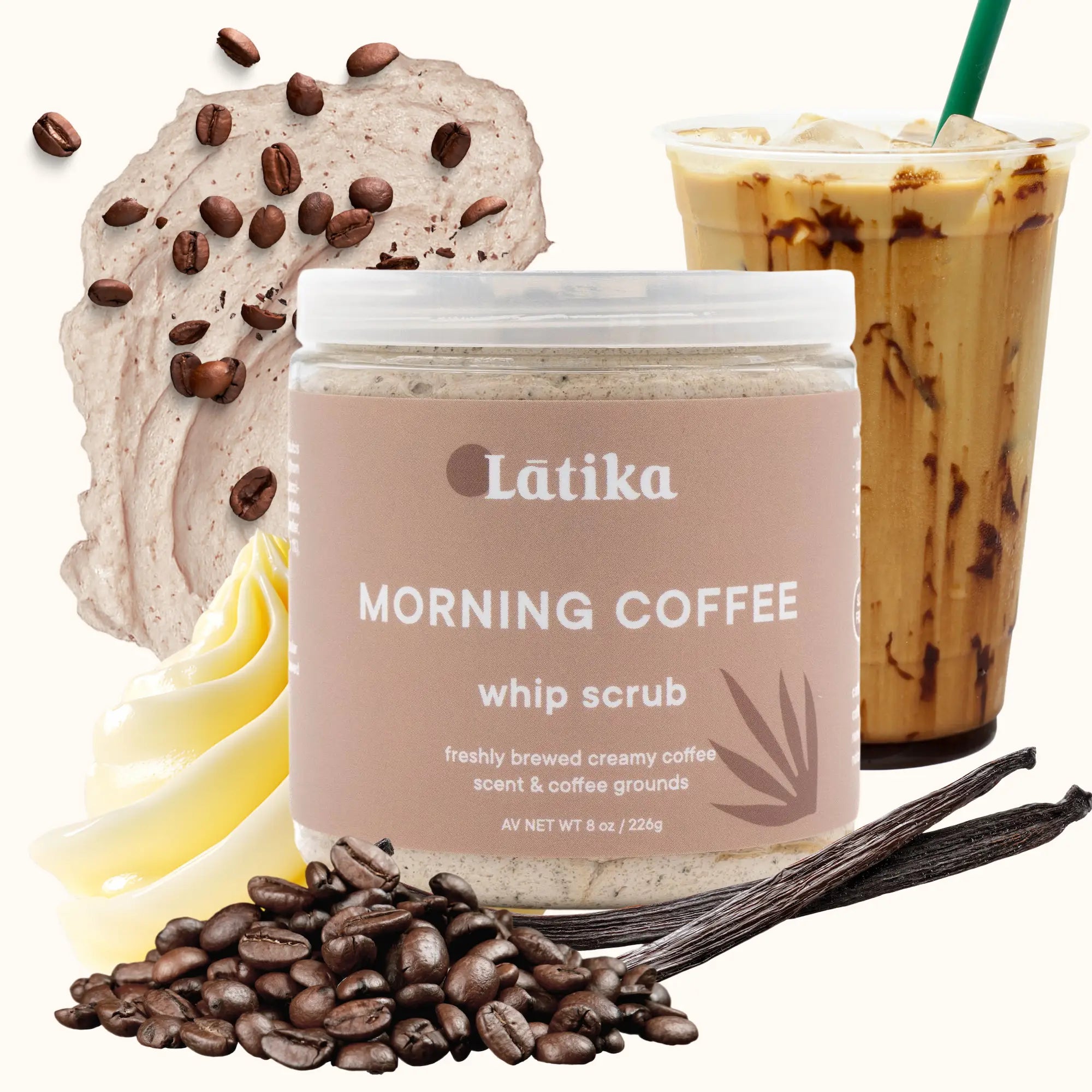 Latika Morning Coffee whip scrub with coffee beans, whipped cream, and iced coffee in the background.