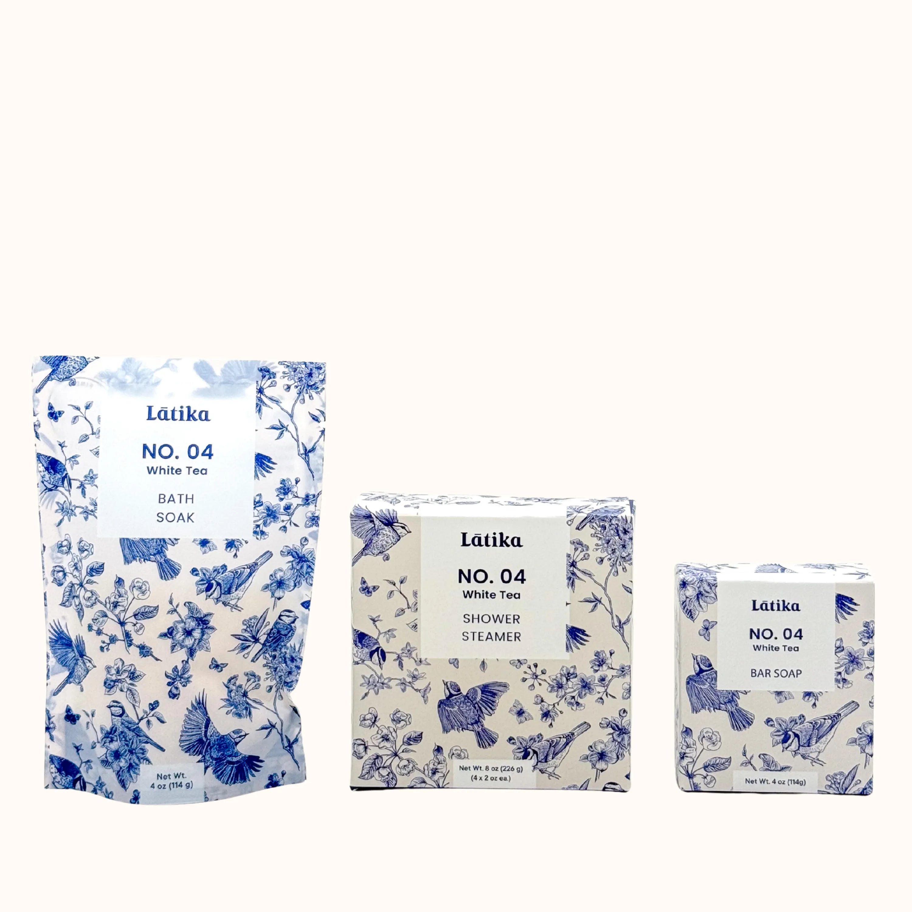 Set of Latika No. 04 White Tea products including bath soak, shower steamer, and bar soap on a white background.