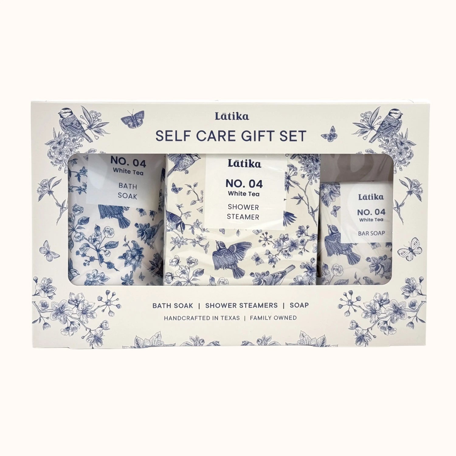Latika self-care gift set with bath soap, shower steamer, and bar soap in decorative packaging.