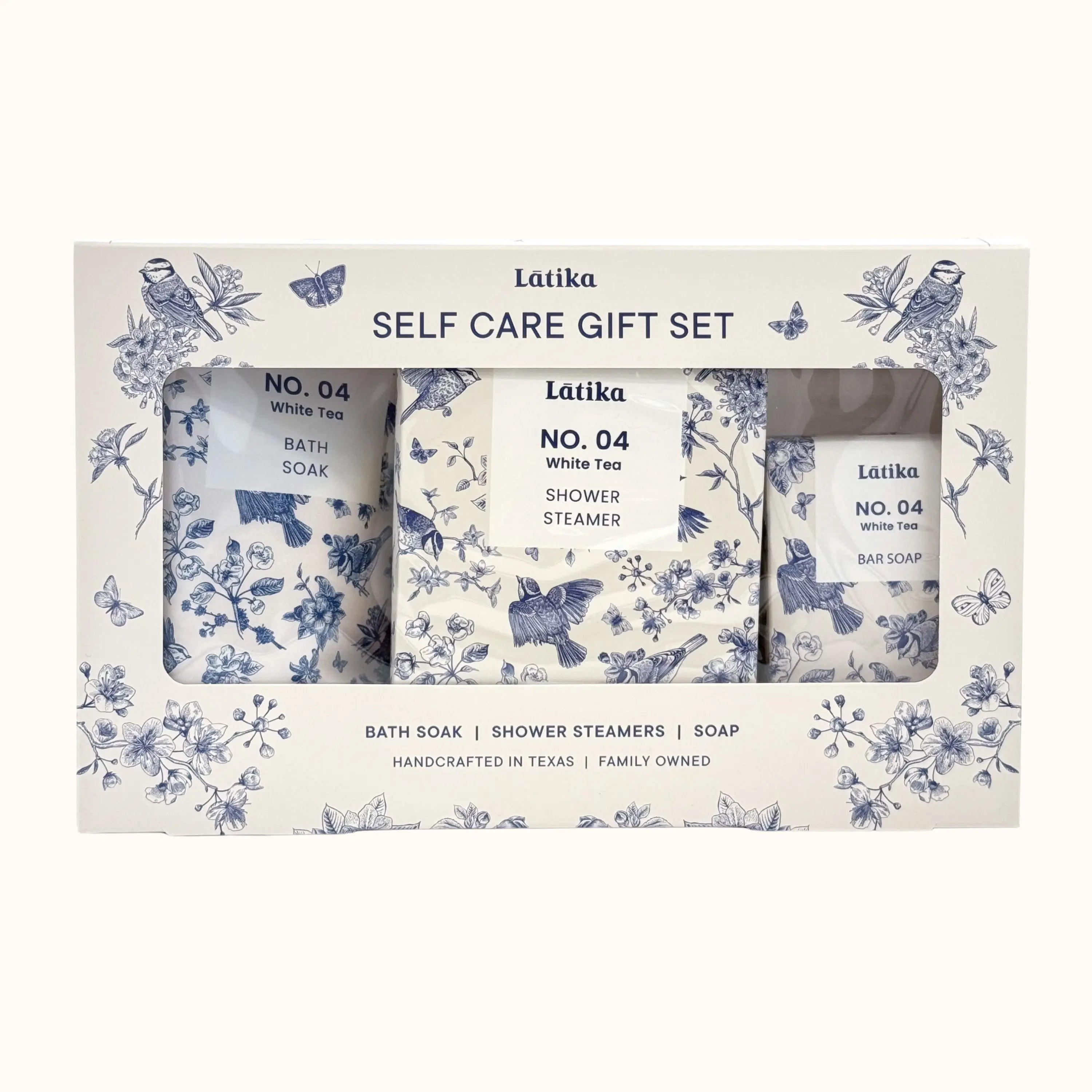 Latika self-care gift set with bath soap, shower steamer, and bar soap in decorative packaging.