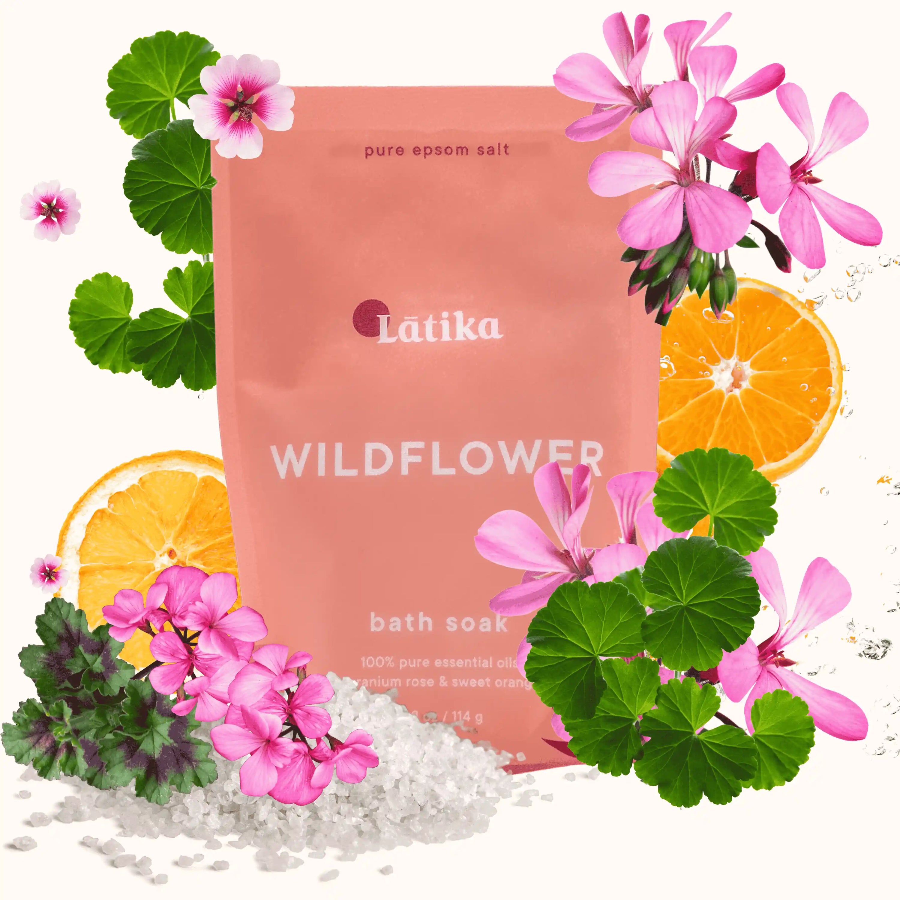 Látika Wildflower bath soak packaging with flowers and oranges on a white background